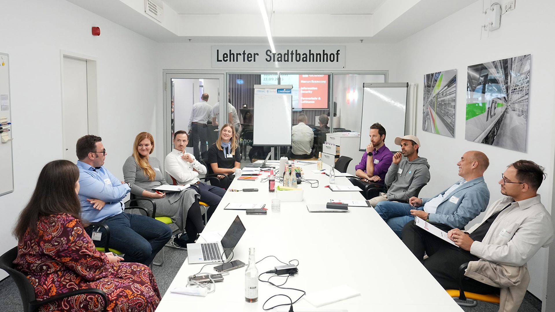 Several people are sitting in a meeting.